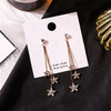 Long universal asymmetrical earrings from pearl with tassels, bright catchy style