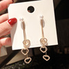 Long universal asymmetrical earrings from pearl with tassels, bright catchy style