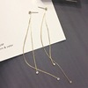 Long universal asymmetrical earrings from pearl with tassels, bright catchy style