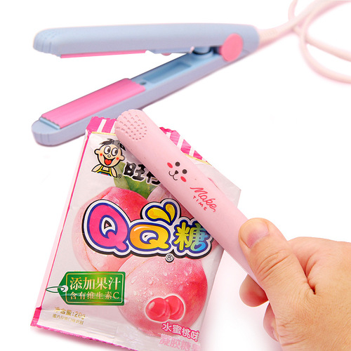 Small household mini portable hard candy sealing machine snack snowflake candy packaging bag sugar paper plastic sealing machine small clapboard