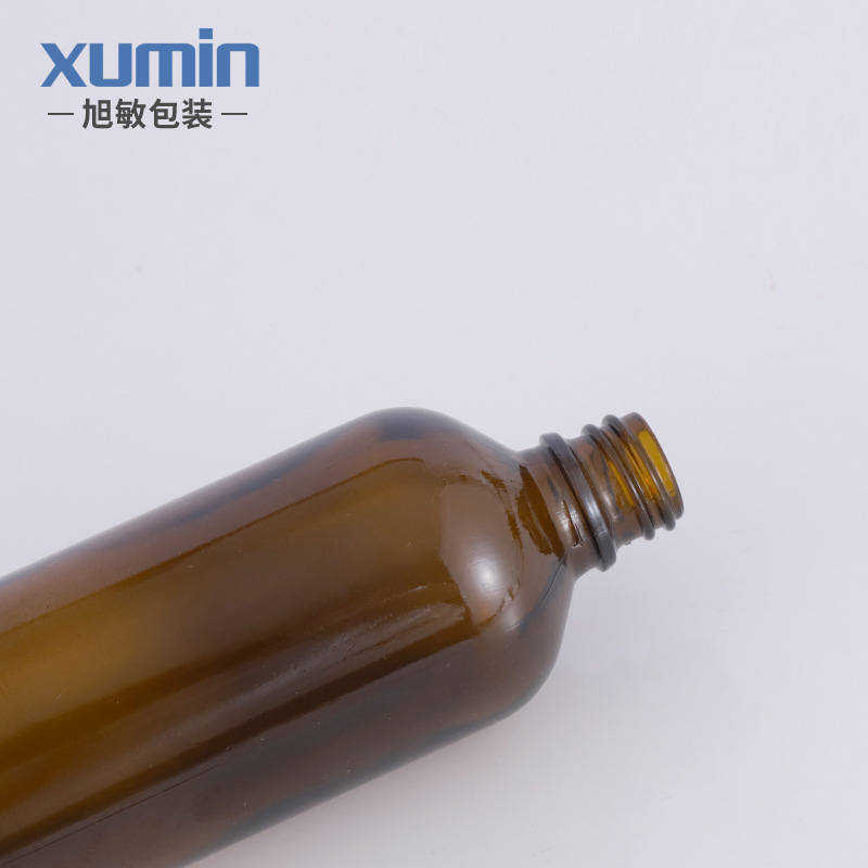 Fábrica en stock botella de aceite esencial de vidrio marrón conveniente sub-botella cuentagotas cosmética Xumin material de embalaje