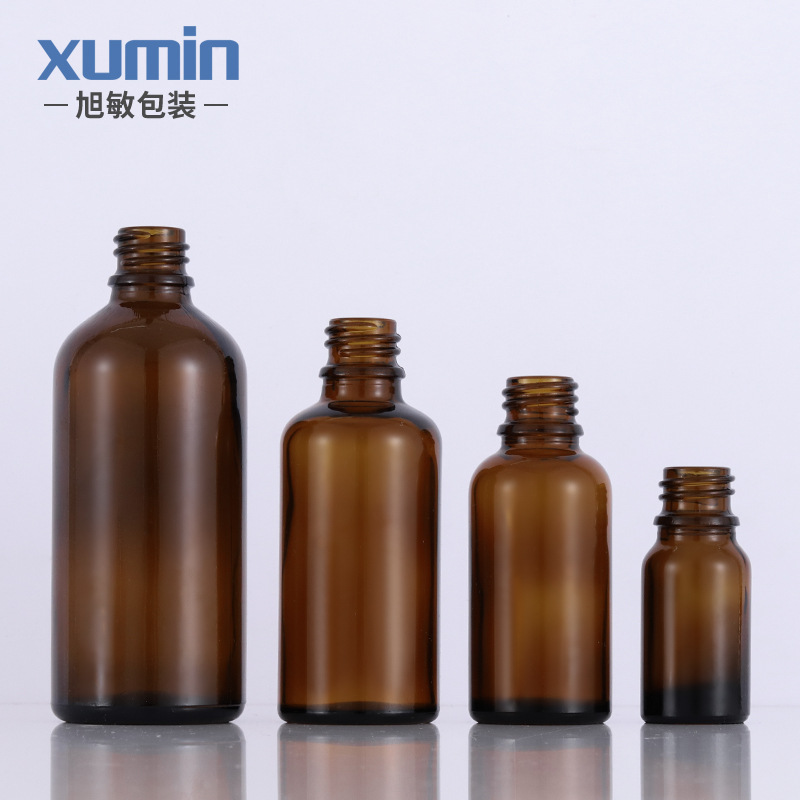 Fábrica en stock botella de aceite esencial de vidrio marrón conveniente sub-botella cuentagotas cosmética Xumin material de embalaje