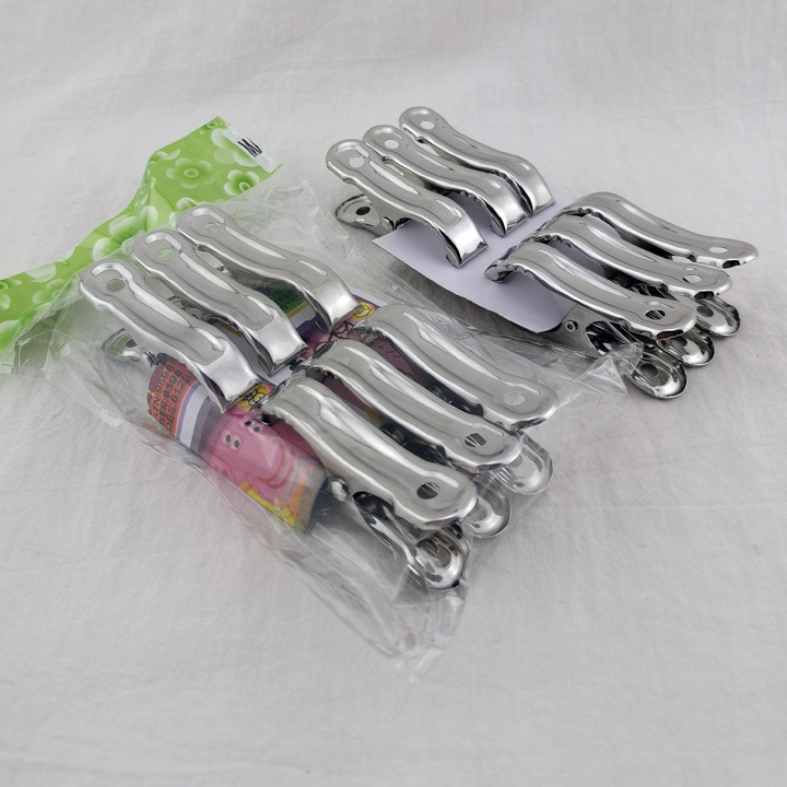 L2342 5cm paquete de seis pequeño edredón clip a prueba de viento clip percha pantalones clip secado calcetines clip Yiwu 2 yuanes tienda al por mayor