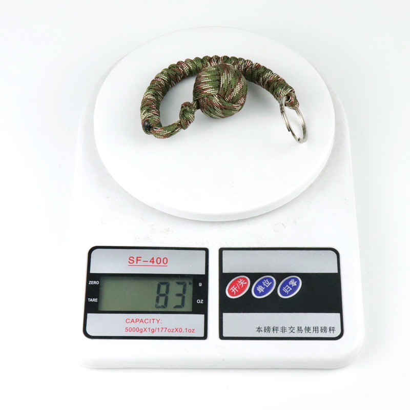 550 cuerda de paraguas montañismo supervivencia autodefensa bola de acero al aire libre nudo de diamante tejido autodefensa Bola de boxeo mono llavero redondo