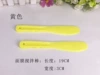 Yellow face mask, scraper
