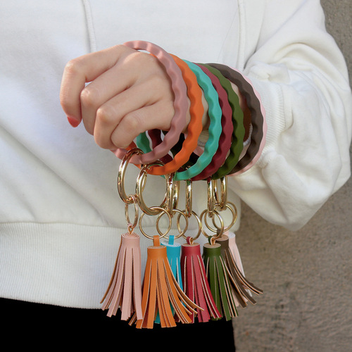 Euro-American wave silicone bracelet keychain with PU tassel pendant fitness wristband key ring