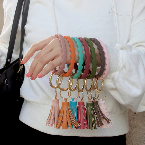 Euro-American wave silicone bracelet keychain with PU tassel pendant fitness wristband key ring