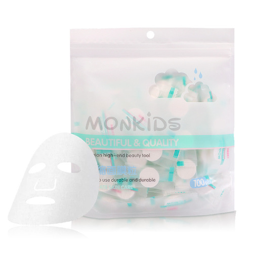 Factory direct sales compressed facial mask 100 bags of DIY disposable candy mask paper non-woven absorbent mask grains