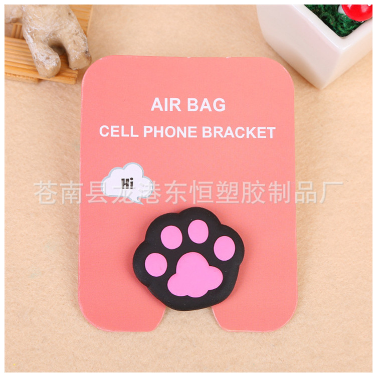 En stock al por mayor TikTok Cartoon creativo soporte de teléfono móvil puede soportar airbag soporte de teléfono móvil soporte de escritorio