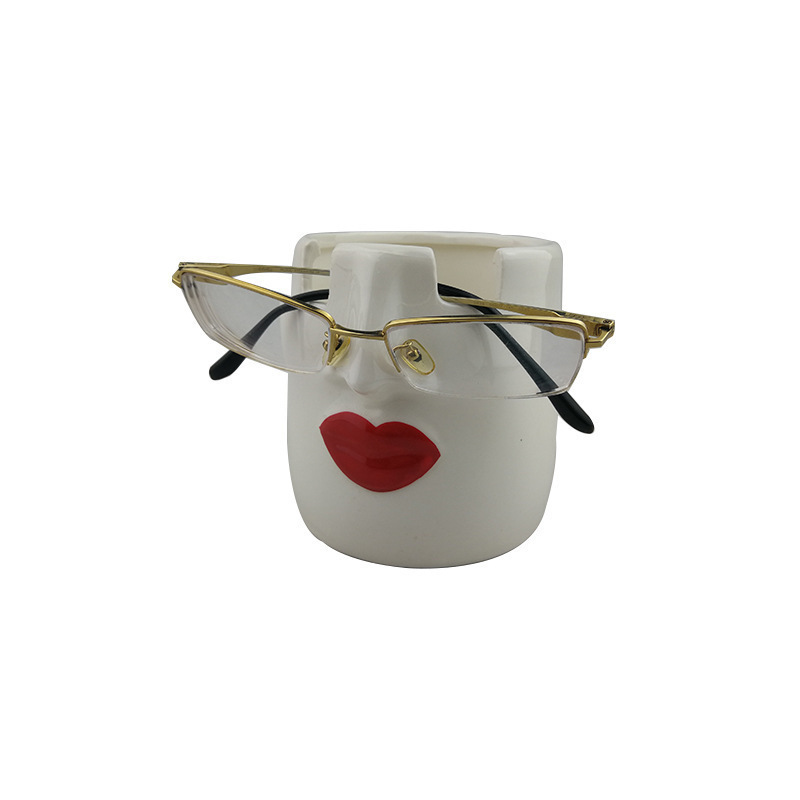 Portalápices de cerámica europea y americana transfronteriza Portalápices de cerámica de colores Portalápices de escultura facial Portalápices de gafas Portalápices de almacenamiento Labios rojos Portalápices de escritorio
