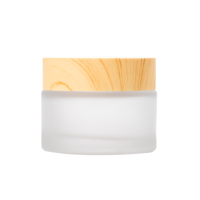Venta al por mayor cubierta de grano de madera 50g botella de crema para los ojos botella de crema facial crema de vidrio esmerilado sub-botella de transferencia de agua muestra de impresión