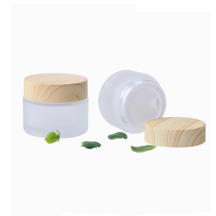 Venta al por mayor cubierta de grano de madera 50g botella de crema para los ojos botella de crema facial crema de vidrio esmerilado sub-botella de transferencia de agua muestra de impresión