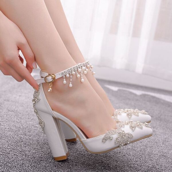 White wedding shoes pointed-toe with extremely high heels for bride