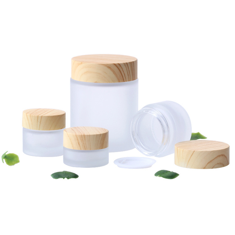 Venta al por mayor cubierta de grano de madera 50g botella de crema para los ojos botella de crema facial crema de vidrio esmerilado sub-botella de transferencia de agua muestra de impresión