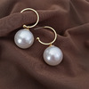 Asymmetrical earrings from pearl, silver 925 sample, simple and elegant design