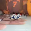 Red and blue stitching (a pair of nude shoes)