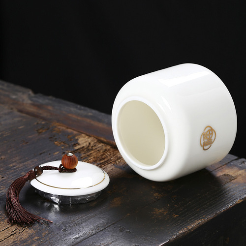 Large mutton-fat jade gold-painted tea jar, creative Chinese white porcelain tea jar, sealed jar, storage jar