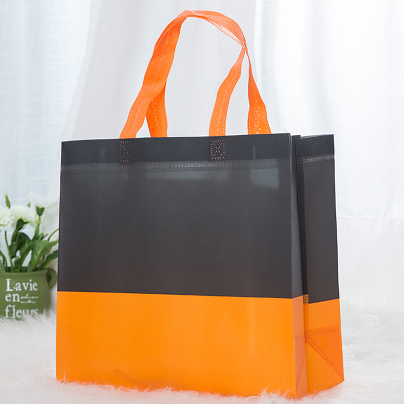 Color a juego bolsa de película no tejida fabricante Promoción de color en stock bolsa no tejida bolsa de compras portátil ropa LOGO