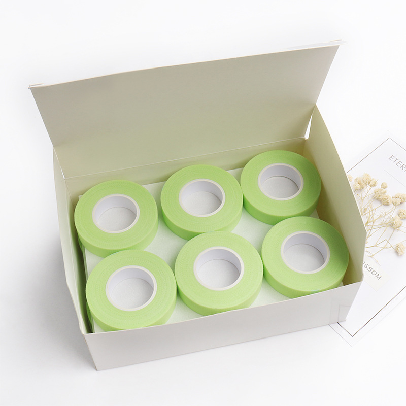 Injerto al por mayor herramienta auxiliar de pestañas aislamiento cinta de pestañas inferior aislamiento de pestañas cinta verde no tejida