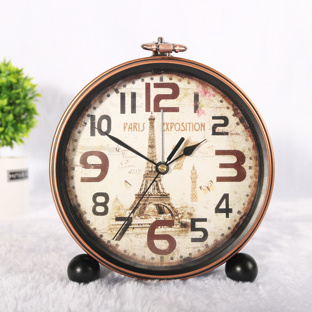 Reloj de hierro retro de estilo europeo alarma creativa Borde de bronce reloj de escritorio mudo negro reloj de asiento venta directa de fábrica al por mayor