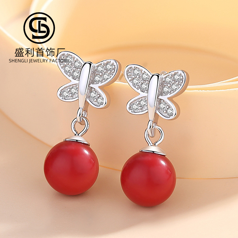 Shengli S925 Pendientes de mariposa de aguja de plata Pendientes de perlas rojas con microincrustaciones de circón Pendientes frescos pequeños japoneses y coreanos Mujeres al por mayor