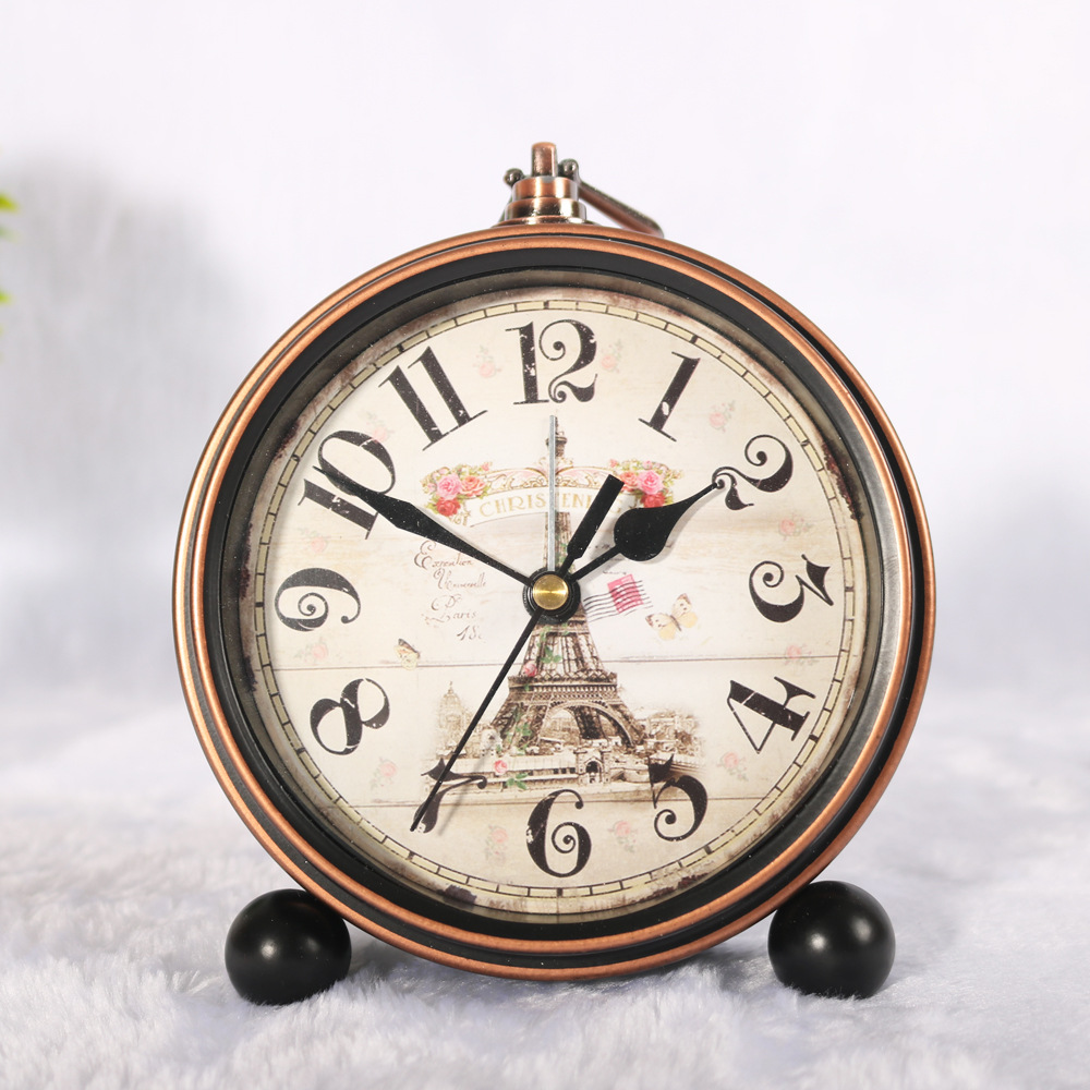 Reloj de hierro retro de estilo europeo alarma creativa Borde de bronce reloj de escritorio mudo negro reloj de asiento venta directa de fábrica al por mayor