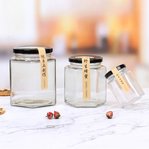 Bulk hexagonal honey jars, hexagonal pickled vegetable jars, glass chili sauce jars, fruit jam canned jars, transparent packaging sealed cans