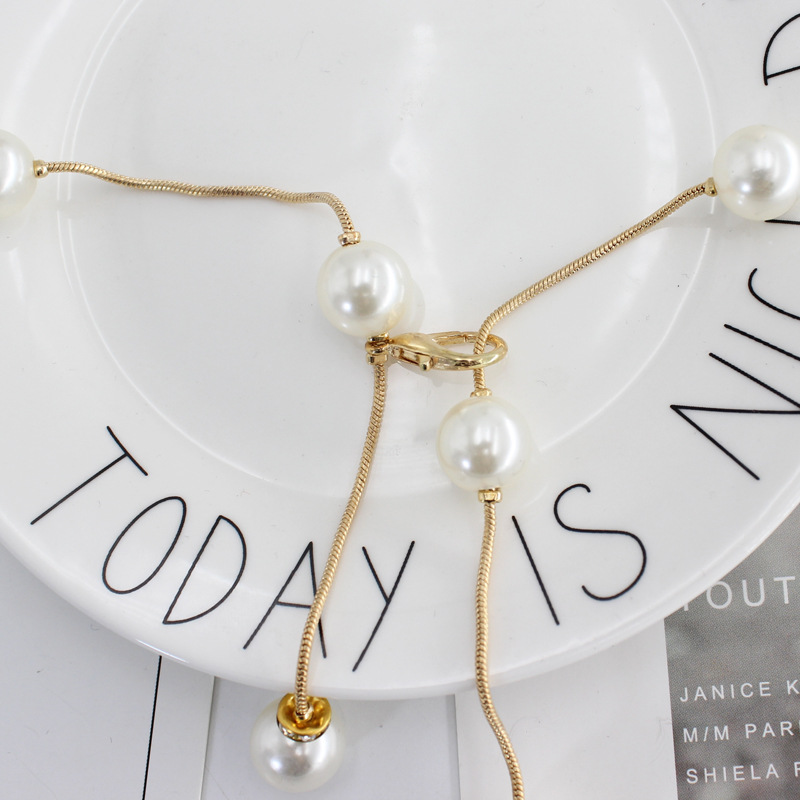 Corea del Sur moda simple vestido perla cintura cadena gancho decorativo delgada falda colgante sexy de las mujeres con entrega de una sola pieza