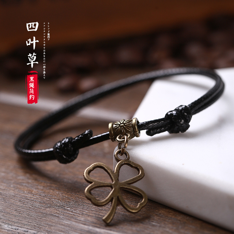 Pulsera tejida a mano – motivos trébole/póker, estilo unisex vintage