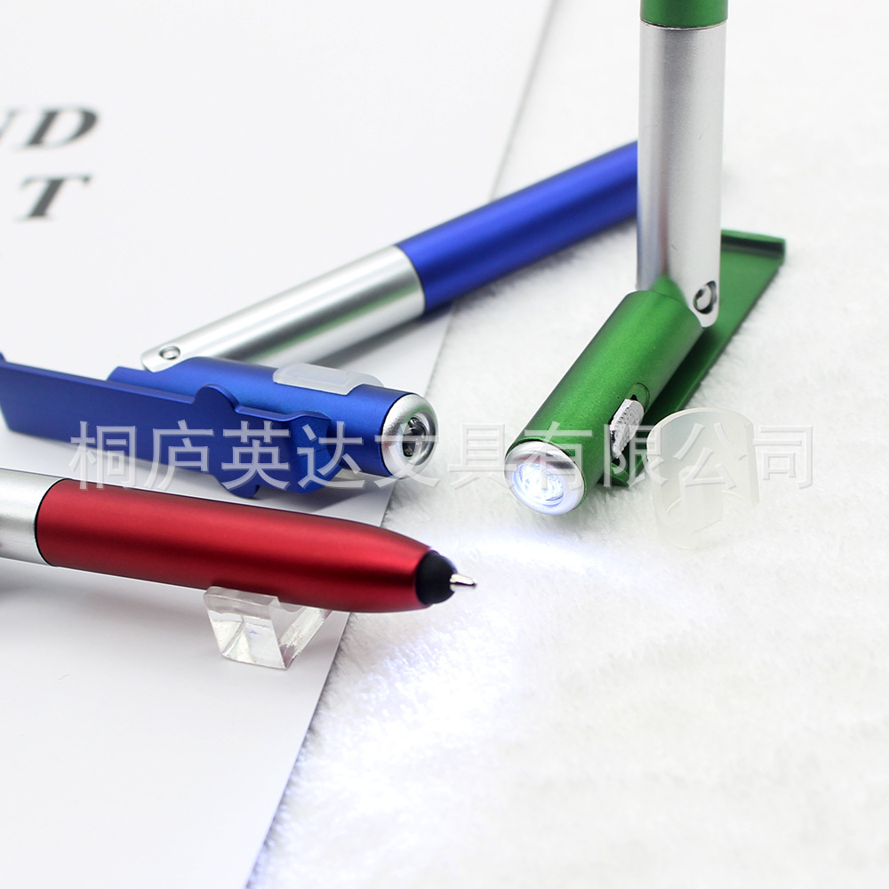 Soporte para teléfono móvil multifuncional luz LED pantalla táctil condensador herramienta bolígrafo impresión publicidad Cuatro en Uno lámpara plegable pluma