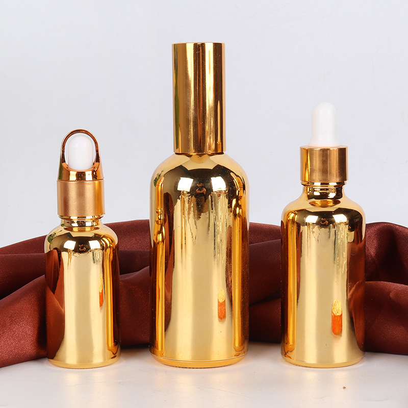 Venta al por mayor de aceite esencial chapado en oro sub-botella de vidrio botella cosmética 10-100ml de plástico cabeza gotero spray sellado botella vacía