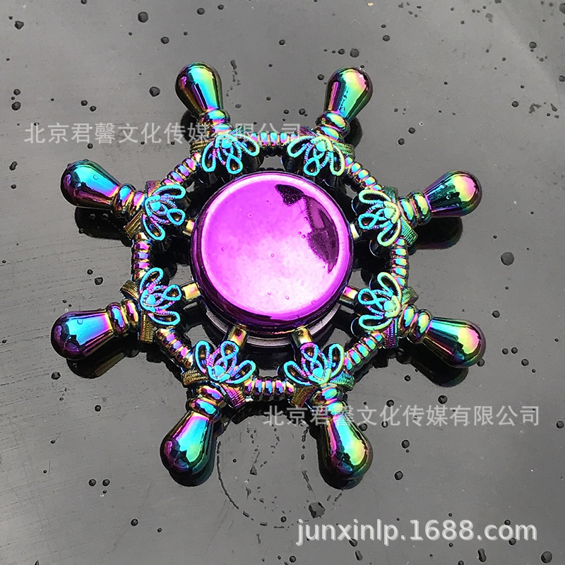 B Dedos de araña de colores, peonza, yema del dedo de metal de tres hojas, peonza de dos hojas, productos pequeños, suministro al por mayor