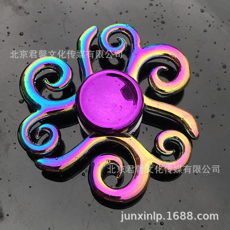 B Dedos de araña de colores, peonza, yema del dedo de metal de tres hojas, peonza de dos hojas, productos pequeños, suministro al por mayor