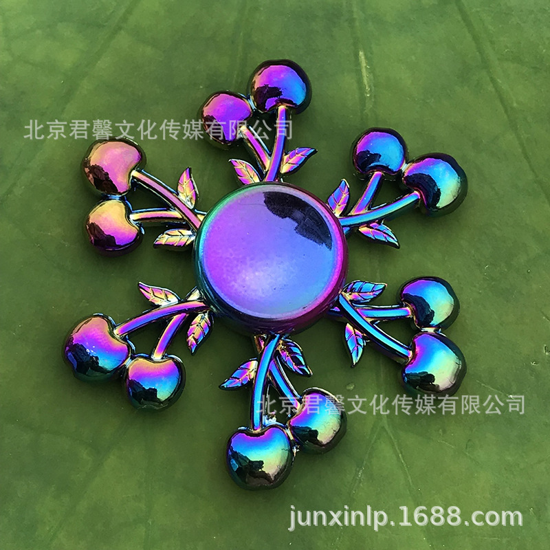 B Dedos de araña de colores, peonza, yema del dedo de metal de tres hojas, peonza de dos hojas, productos pequeños, suministro al por mayor