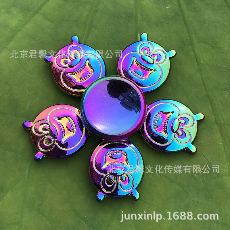 B Dedos de araña de colores, peonza, yema del dedo de metal de tres hojas, peonza de dos hojas, productos pequeños, suministro al por mayor