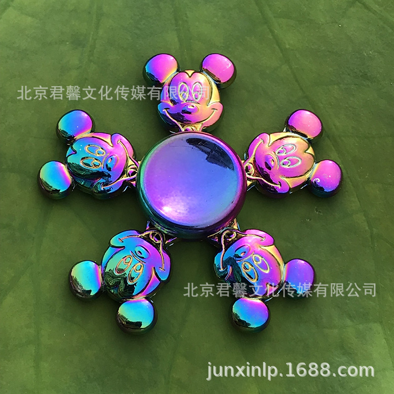 B Dedos de araña de colores, peonza, yema del dedo de metal de tres hojas, peonza de dos hojas, productos pequeños, suministro al por mayor