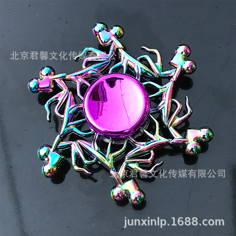 B Dedos de araña de colores, peonza, yema del dedo de metal de tres hojas, peonza de dos hojas, productos pequeños, suministro al por mayor