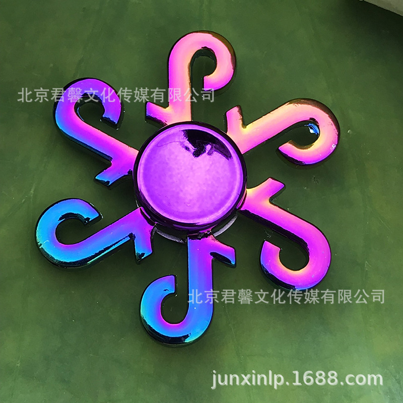 B Dedos de araña de colores, peonza, yema del dedo de metal de tres hojas, peonza de dos hojas, productos pequeños, suministro al por mayor