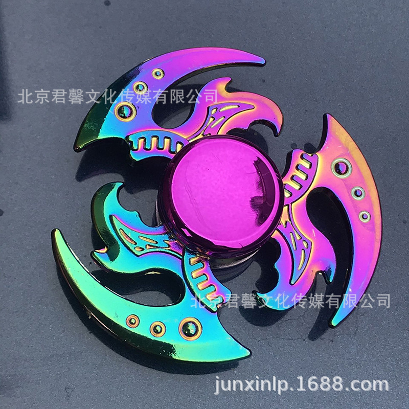 B Dedos de araña de colores, peonza, yema del dedo de metal de tres hojas, peonza de dos hojas, productos pequeños, suministro al por mayor