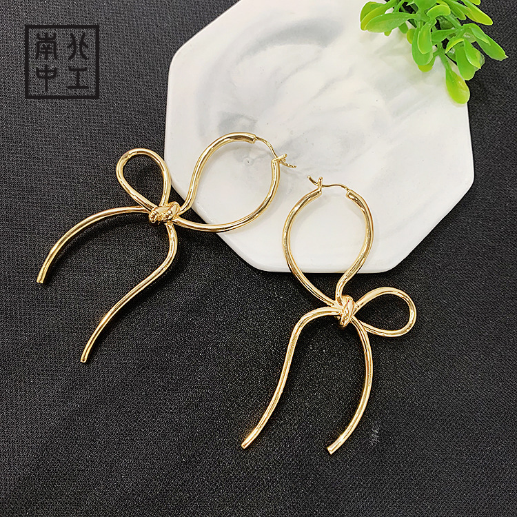 洛洋首饰 欧美冷淡风夸张个性不对称蝴蝶结中国结显瘦耳钉代批发