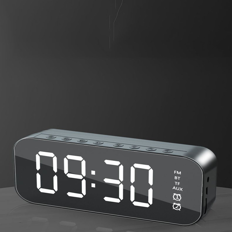 Nuevo reloj despertador Bluetooth audio inalámbrico Tarjeta de radio escritorio mini pequeña pistola acero altavoz espejo teléfono móvil altavoz