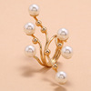 Fashionable trend golden ring from pearl, European style, on index finger