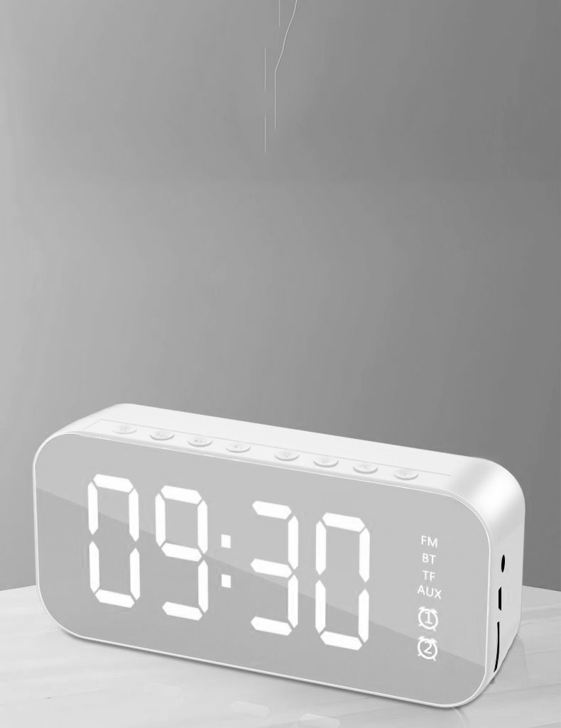 Nuevo reloj despertador Bluetooth audio inalámbrico Tarjeta de radio escritorio mini pequeña pistola acero altavoz espejo teléfono móvil altavoz