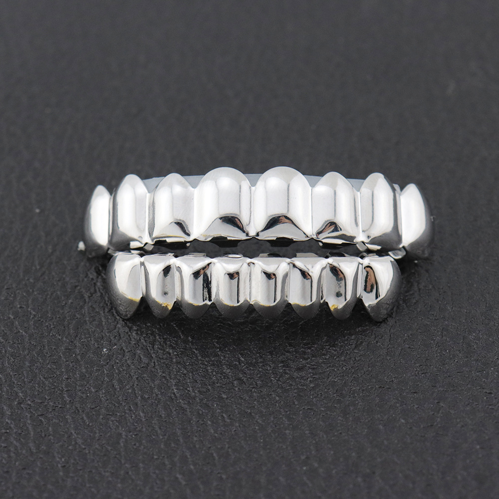 Personalidad europea y americana moda hip hop brackets dientes superiores 8 dientes inferiores 8 18K chapado en oro masculino y femenino suicidio HIPHOP brackets