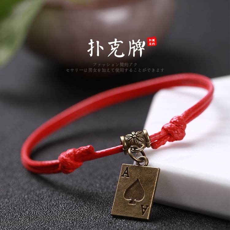 Pulsera tejida a mano – motivos trébole/póker, estilo unisex vintage