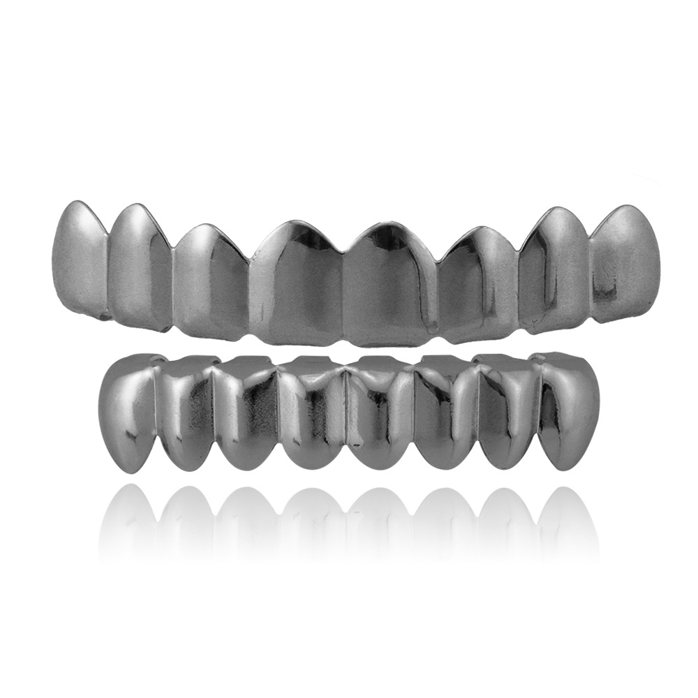 Personalidad europea y americana moda hip hop brackets dientes superiores 8 dientes inferiores 8 18K chapado en oro masculino y femenino suicidio HIPHOP brackets