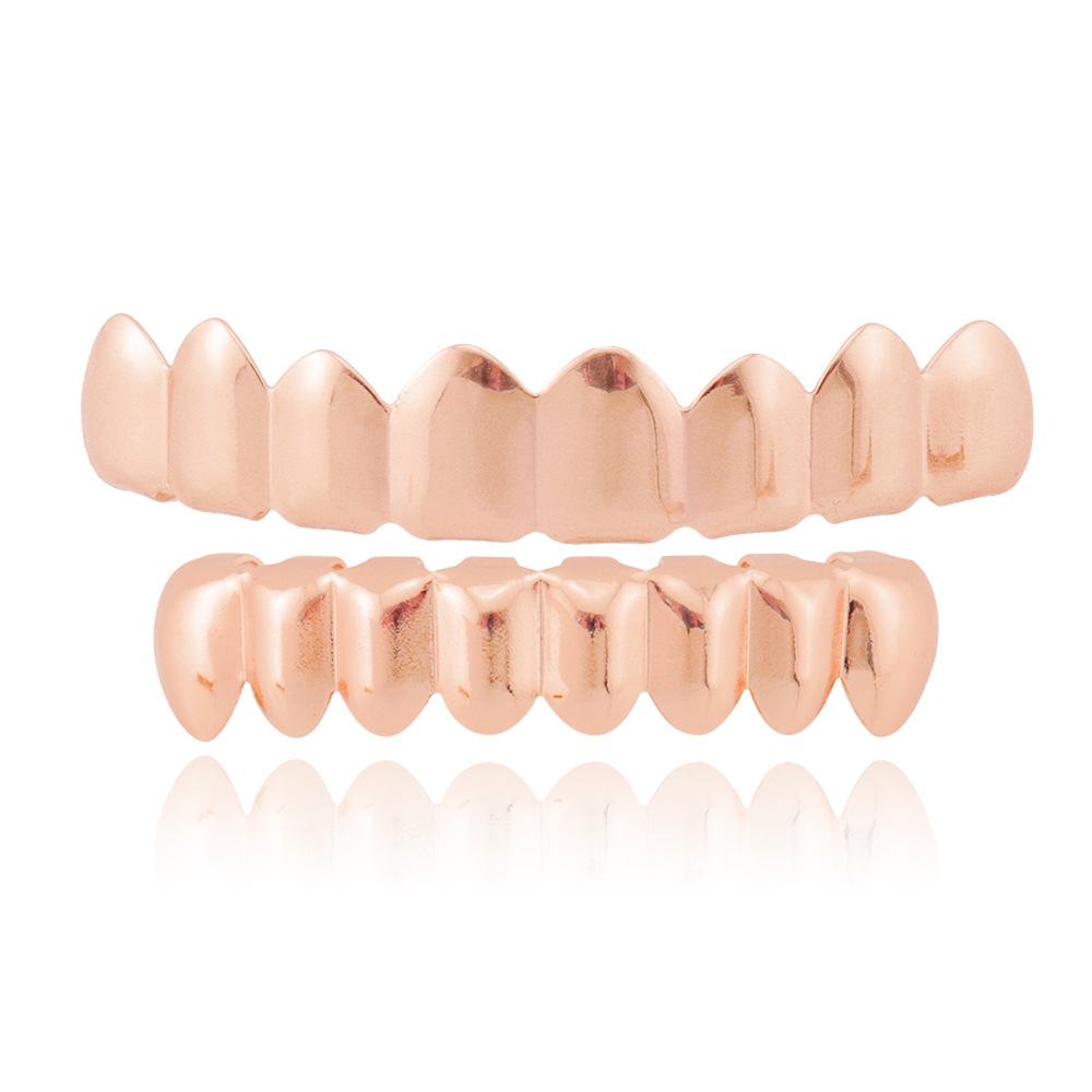 Personalidad europea y americana moda hip hop brackets dientes superiores 8 dientes inferiores 8 18K chapado en oro masculino y femenino suicidio HIPHOP brackets