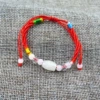 White round beads, red rope bracelet