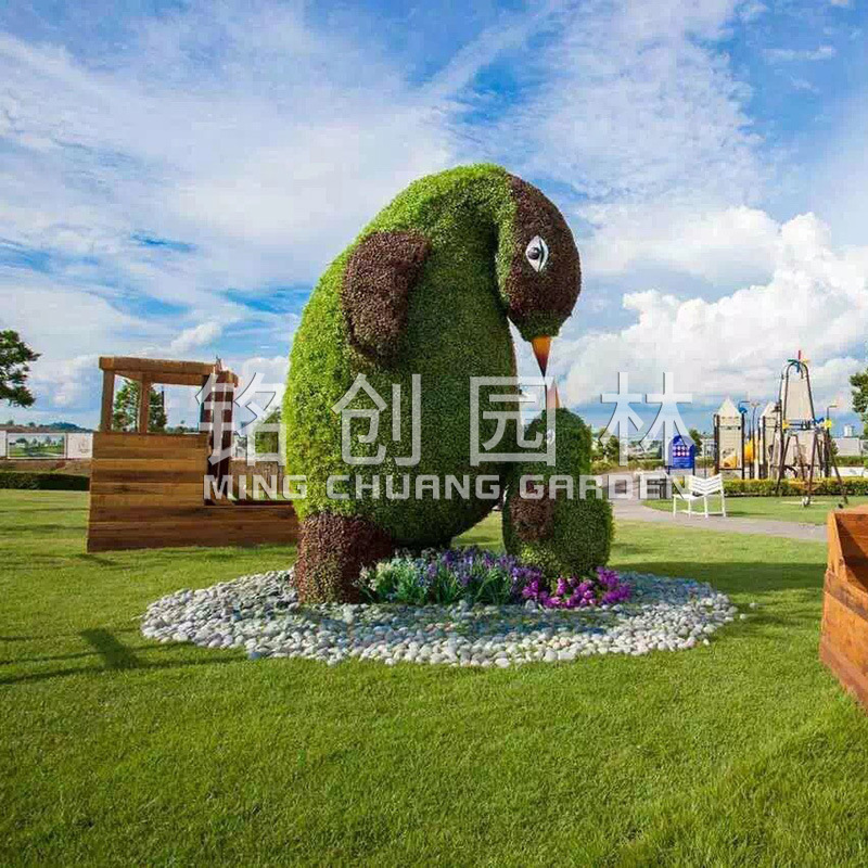 Flor artificial Escultura de arte de talla verde Imagen de animal Día nacional Día nacional Forma de plantación de césped Decoración de planta verde Alta simulación