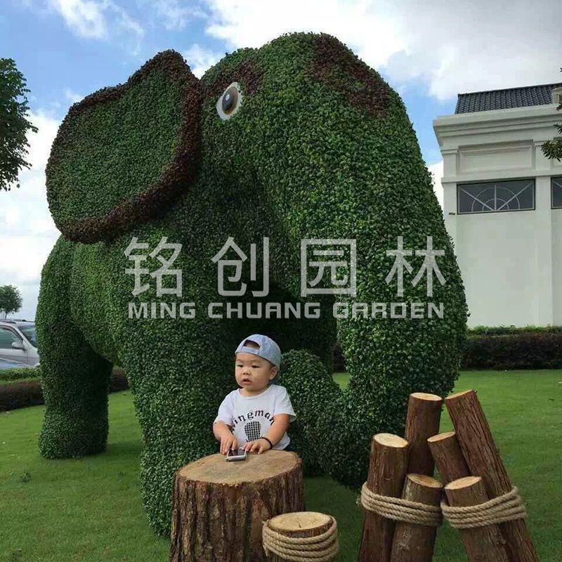 Flor artificial Escultura de arte de talla verde Imagen de animal Día nacional Día nacional Forma de plantación de césped Decoración de planta verde Alta simulación